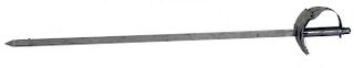 Card Sword. Hamburg: Bartl, ca. 1910. A selected card is speared on the end of this large nickel-pla