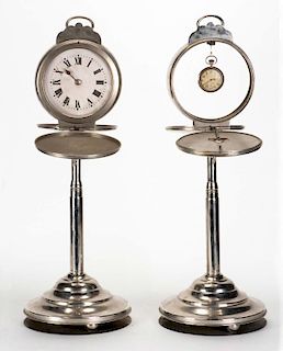 Hora Pasera. Hamburg: Janos Bartl, ca. 1935. A pocket watch and alarm clock are placed in two tall n