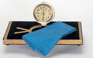 Vanishing Alarm Clock. British, ca. 1960. A ringing alarm clock covered with a cloth is removed from