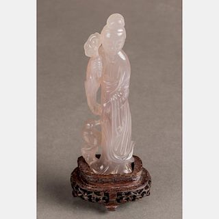 A Chinese Carved Agate Figure of Guanyin on a Carved Hardwood Stand.