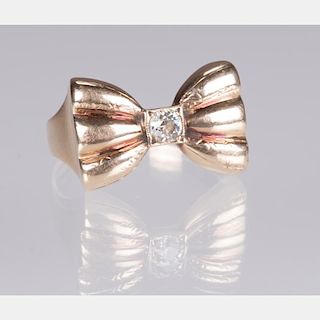 A 14kt. Yellow Gold and Diamond Bow Form Ring,