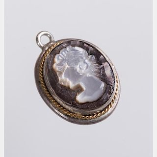 A Silver and Shell Cameo Pendant.