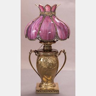 A Pairpoint Art Nouveau Style Polished Brass Oil Lamp, 20th Century,