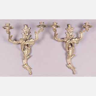 A Pair of Louis XV Style Gilt Brass Two Arm Wall Sconces, 20th Century.