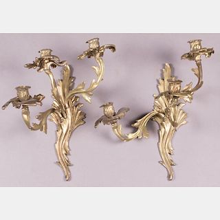 A Pair of Louis XV Style Gilt Brass Three Arm Wall Sconces 20th Century.