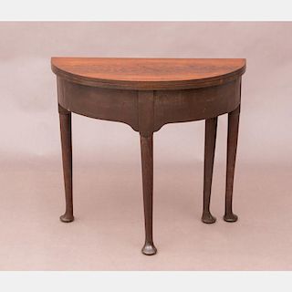 A Queen Anne Rosewood and Mahogany Flip Top Table, 19th Century.