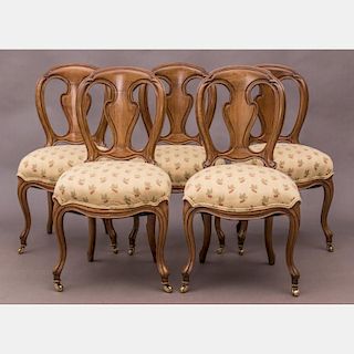 A Group of Five French Provincial Style Walnut Side Chairs, 20th Century.