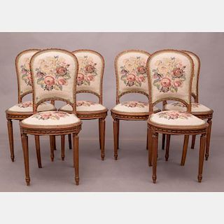 A Set of Six Louis XVI Mahogany Dining Chairs, 20th Century.