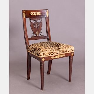 A French Empire Mahogany Side Chair with Ormolu Mounts, 19th Century.