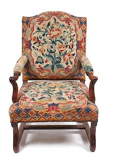 * A French Provincial Tapestry Upholstered Walnut Fauteuil Height 41 1/2 inches.