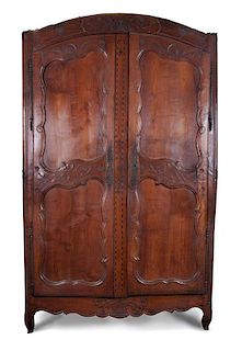 * A French Provincial Relief Carved Walnut Armoire Height 88 x width 57 1/2 x depth 18 inches.