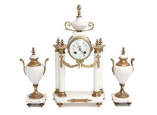 A Three-Piece Marble Clock Garniture Height 16 1/2 inches.