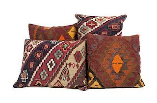 * A Collection of Four Kilim Upholstered Pillows Height of largest 16 inches.