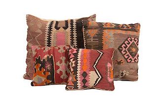 * A Collection of Four Custom Upholstered Pillows