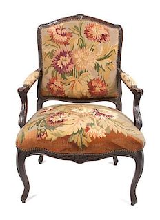 * A Louis XV Tapestry Upholstered Fauteuil Height 35 3/4 inches.