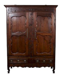 * A French Relief Carved Oak Armoire Height 85 x width 61 x depth 21 inches.