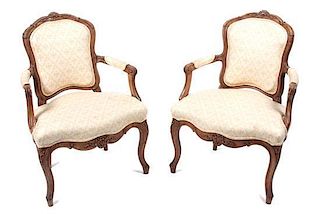 A Set of Four Louis XV Style Fauteuils Height 34 inches.