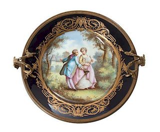 * A French Gilt Bronze Mounted Sevres Porcelain Plate Diameter 10 1/4 inches.