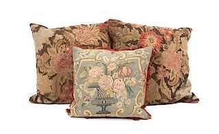 * A Collection of Three Needlepoint Pillows Height of largest 19 inches.