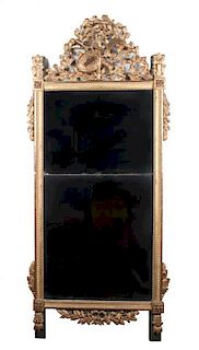 A Louis XVI Giltwood Pier Mirror Height 78 1/2 x width 34 1/2 inches.