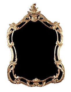 * An Italian Giltwood Mirror Height 52 x width 34 1/2 inches.