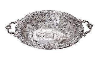 * A Dutch Silver Repousse Serving Bowl, , of oval, two-handled form, with pierced sides and foliate rim centering a narrative.