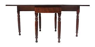 An English Mahogany Drop-Leaf Table Height 29 1/2 x width 46 x depth 41 1/2 inches.