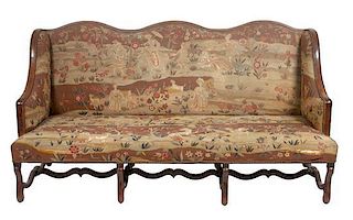 * A Victorian Tapestry Upholstered Wing-Back Settee Height 40 x width 77 x depth 34 inches.
