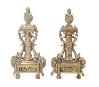 A Pair of Continental Gilt Bronze Chenets Height of each 13 1/4 inches.