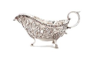 An American Silver Sauce Boat, S. KIRK & SON, BALTIMORE, MD, EARLY 20TH CENTURY, embossed and chased overall with dense flowers