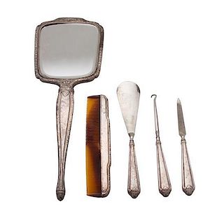 * An American Silver Dresser Set, INTERNATIONAL SILVER CO., comprising a hand mirror, comb, button hook, shoe horn and nail file