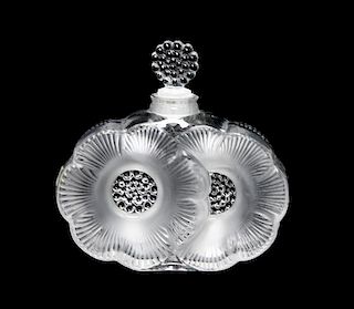 A Lalique Molded and Frosted Glass Perfume Bottle Height 3 3/4 inches.