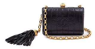 A Chanel Black Embossed Leather Evening Bag, 5.5" x 4" x 2.5".