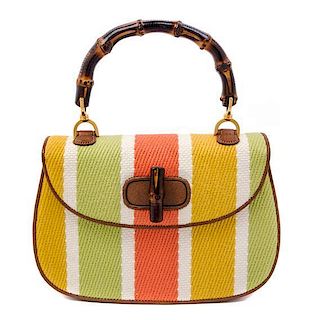A Gucci Brown Leather and Woven Bamboo Top Handle Handbag, 10.5" x 7" x 3".