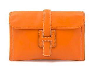 * An Hermes Orange Jige Elan 29 Swift Clutch, 11.5" x 6" 1.5".