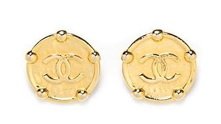 A Pair of Chanel Hammered Goldtone Earclips, 1.5" x 1.5".