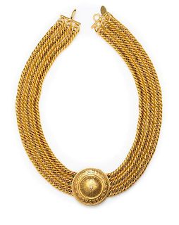 A Chanel Triple Strand Goldtone Necklace, 17" x 1.5".