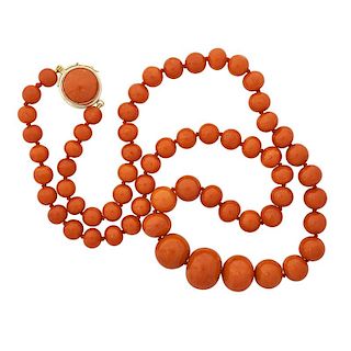A DEEP SALMON COLORED CORAL BEAD NECKLACE