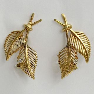 Pair of Vintage 14 Karat Yellow Gold Leaf Earrings each accented with a small round cut diamond.