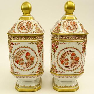 Pair of French Porcelain Hand Decorated Covered Footed Jars.
