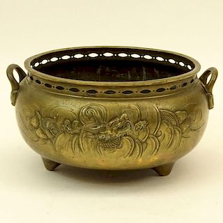 Large 18/19th Century Chinese Bronze Censer. Tri-Footed relief of dragons and clouds motif. Pierced rim.