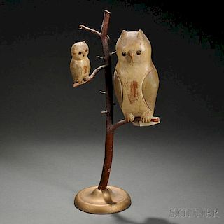 Two Painted and Carved Owl Figures on a Branch