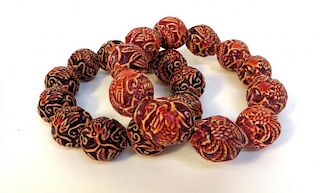 Two Bracelets Made Of Carved Beads