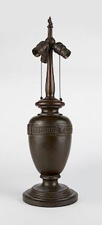 A patinated bronze lamp base, Handel