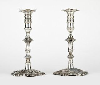 A pair of George IV sterling silver candlesticks