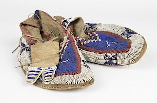 A pair of Plains Indian beaded moccasins