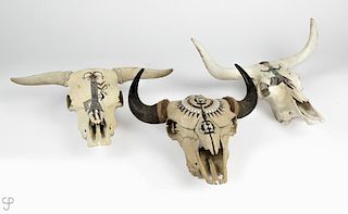 Three painted skulls; two longhorn, one buffalo