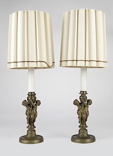 A pair of patinated bronze table lamps