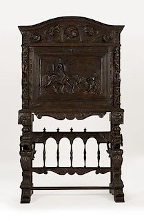 A Spanish carved fall-front cabinet