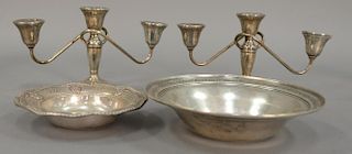 Four pieces of sterling silver to include two bowls (dia. 6 3/4" & 9") and a pair of candelabra (ht. 6"), 9.4 weighable troy ounces